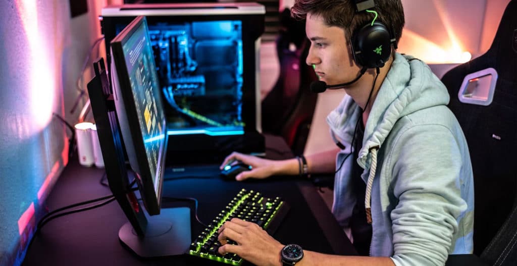 Man sitting at PC playing games and esports
