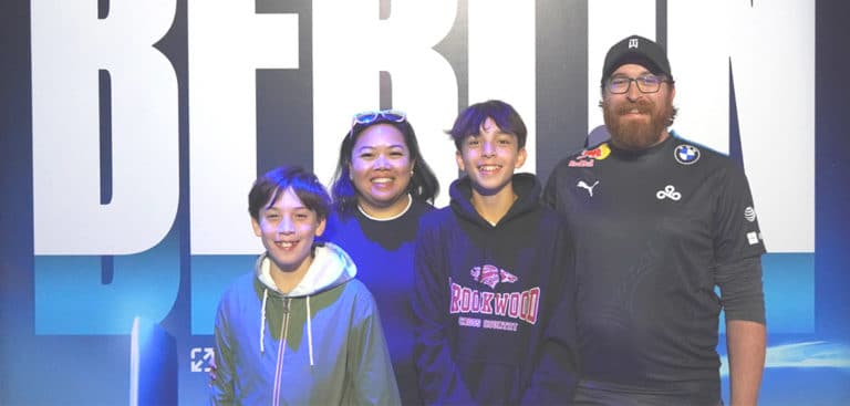 The Wonneberger family pose in the Riot Games Arena in Berlin at Worlds 2024 as League of Legends fans