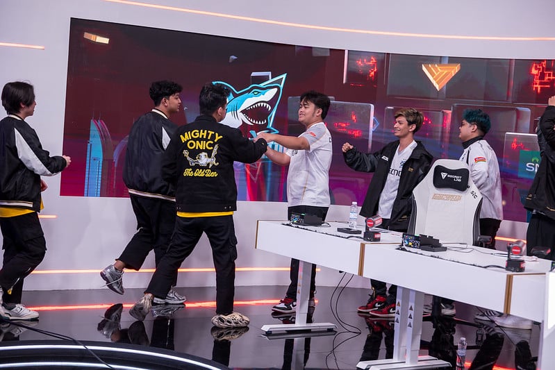 MLBB Esports World Cup stage, featuring placers walking to fist-bump each other after playing a match
