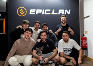 EPIC.LAN 45 Finals winners Iberian Soul pose in front of the EPIC.LAN logo with their trophy.