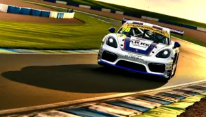 Porsche Cayman GT4 RS race car cornering at Donington Park circuit in Sprint Challenge GB competition