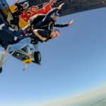 Mongraal skydiving from a red bull plane.